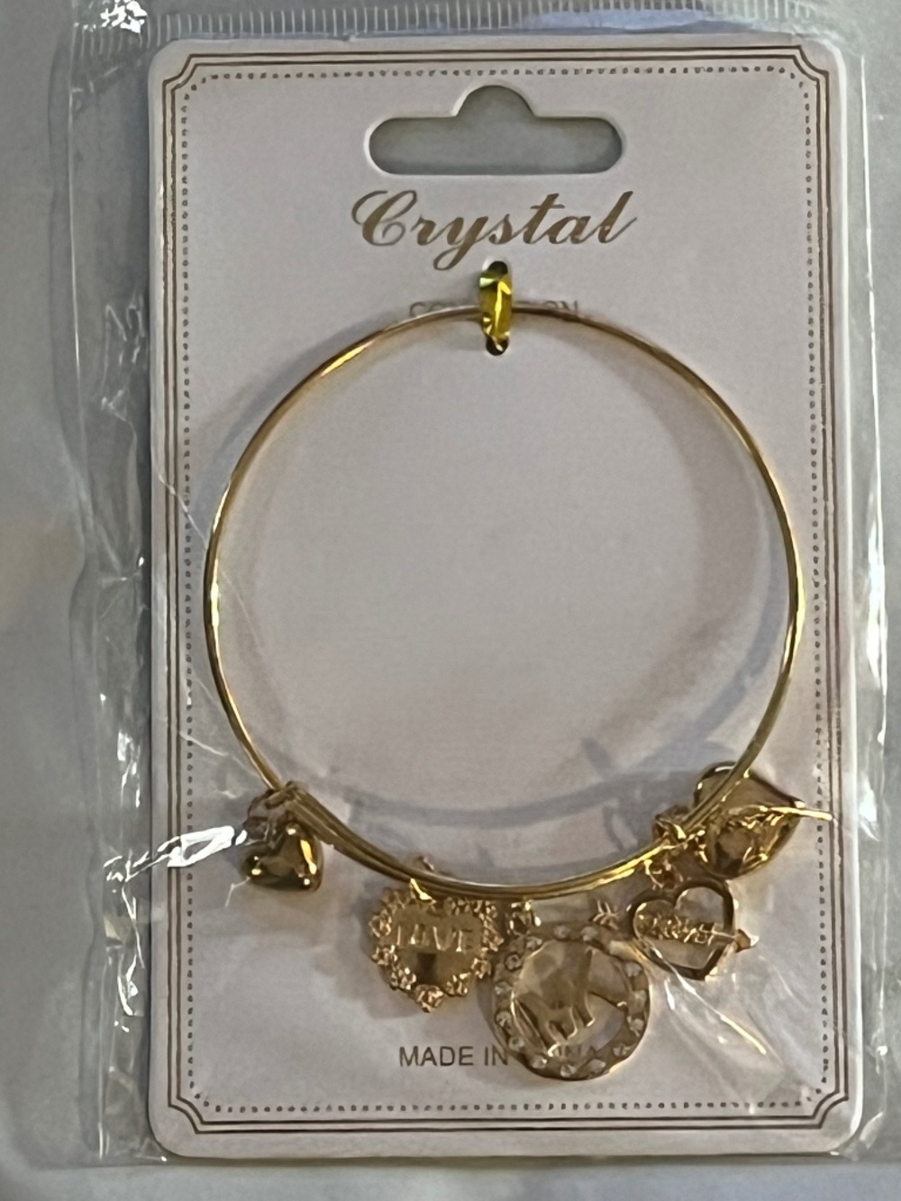 Crystal gold toned bracelet w/ MK charm